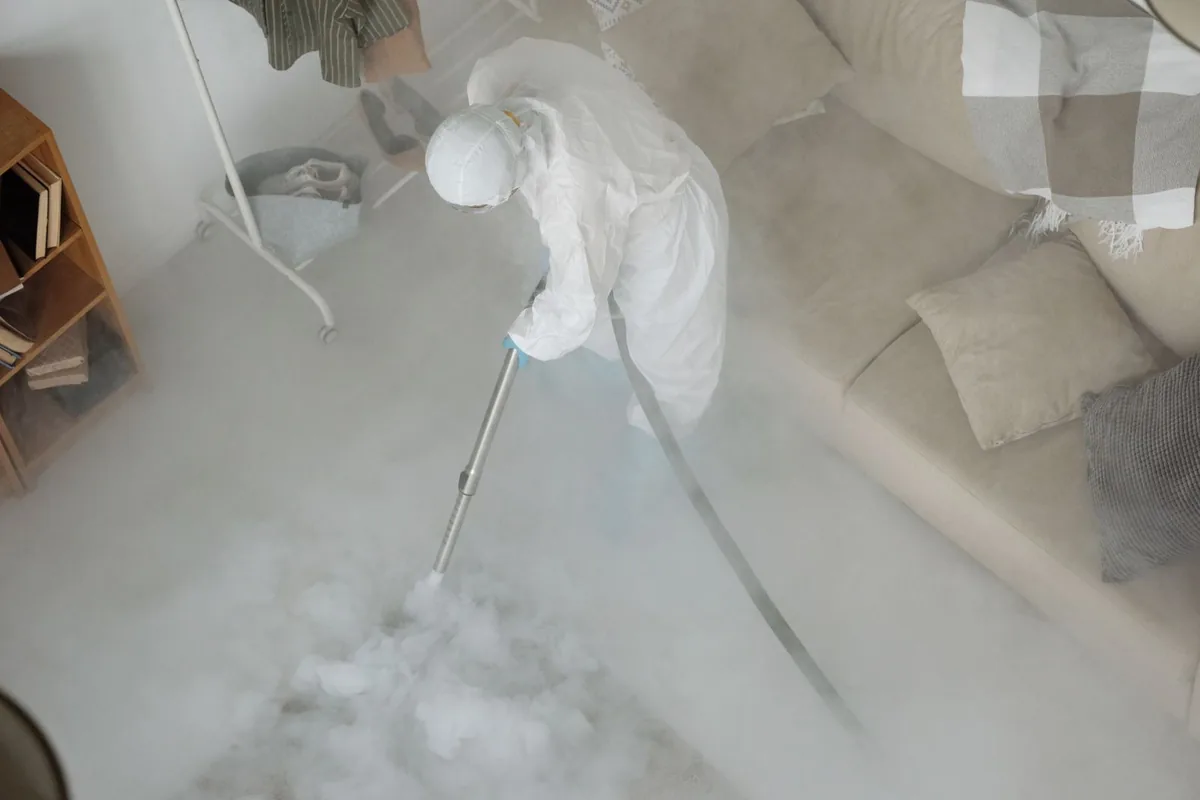 Biohazard cleanup technician in protective equipment, Des Peres, MO